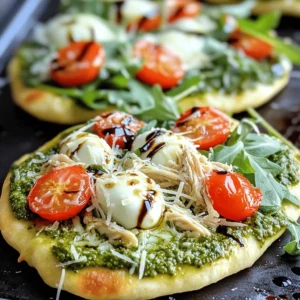 - 2 flatbreads (store-bought or homemade) - 1 cup cooked chicken breast, shredded - 1/2 cup basil pesto - 1 cup cherry tomatoes, halved - 1 cup fresh mozzarella cheese, shredded - 1/4 cup grated Parmesan cheese - 2 cups fresh arugula - 1 tablespoon balsamic glaze (for drizzling) - Salt and pepper to taste When I make pesto chicken flatbread, I love to keep it simple yet flavorful. The main ingredients are easy to find. You can use flatbreads from the store or make them at home if you feel adventurous. The cooked chicken breast gives a nice protein boost. Shredding it saves time and blends well with the pesto. Speaking of pesto, don’t skimp on it! That half cup packs a lot of flavor into each bite. Now for the toppings! Halved cherry tomatoes add a burst of freshness. I usually go for fresh mozzarella cheese, as it melts beautifully. A sprinkle of grated Parmesan cheese adds a nice, salty kick. Finally, the garnishes tie everything together. Fresh arugula adds a peppery crunch, while balsamic glaze brings a sweet tang. Don’t forget to season with salt and pepper to taste. You can find the Full Recipe to help guide you through the steps and enjoy this tasty meal! - Preheat the oven to 400°F (200°C). - Prepare flatbreads on a lined baking sheet. I like parchment paper for easy cleanup. - Spread basil pesto evenly over each flatbread. Make sure to cover every inch for the best flavor. - Distribute shredded chicken evenly over the pesto. This adds protein and makes it hearty. - Top with halved cherry tomatoes and cheeses. The tomatoes bring freshness, and the cheese melts beautifully. - Season with salt and pepper, then bake for 10-12 minutes. Look for melted cheese and a golden edge. - Let cool for a minute and add fresh arugula. This adds a nice crunch and balance. - Drizzle with balsamic glaze before serving. The tangy sweetness pairs well with all the flavors. For the full recipe, check out the details above! To achieve a golden-brown edge, keep an eye on the oven. Bake the flatbread at 400°F (200°C) for about 10-12 minutes. Watch for the cheese to melt and the edges to crisp up. If you want more color, broil for a minute at the end. Balancing toppings is key for optimal flavor. Spread the pesto evenly, but don’t overload it. A layer of chicken, followed by cheese, gives it a nice structure. Use cherry tomatoes for a fresh burst, but not too many. This way, the flavors shine without overwhelming the flatbread. For side dishes, pair your flatbread with a light salad or some roasted veggies. A simple arugula salad with lemon vinaigrette works great. For drinks, try sparkling water or a light white wine. These choices keep the meal refreshing. When presenting at gatherings, serve the flatbreads on a large wooden board. Cut them into small squares for easy sharing. Garnish with extra arugula and cherry tomatoes to make it colorful and inviting. You can create vegetarian variations by swapping chicken for roasted veggies. Try using zucchini, bell peppers, or mushrooms. They add great flavor and texture. To spice it up, add some red pepper flakes or sliced jalapeños. You can also use different cheeses like goat cheese or feta for a unique twist. Don't be afraid to experiment; this dish is all about your taste! {{image_4}} You can switch up your protein for the Pesto Chicken Flatbread. Grilled shrimp offers a nice, light flavor. Shrimp cooks quickly and pairs well with pesto. If you prefer beef, grilled steak can bring rich flavors. Slice it thin and spread it over the flatbread. For those on a plant-based diet, use chickpeas or tofu as a vegan substitute. Both options soak up the pesto’s flavor well. To give your flatbread a special twist, try different types of pesto. Sun-dried tomato pesto can add a rich, sweet taste. You can also make a spicy version with red pepper flakes or add fresh herbs like basil or oregano. These additions can take your dish to the next level. Experiment with flavors that you enjoy to personalize your flatbread. Using seasonal vegetables can elevate your flatbread. Fresh zucchini, bell peppers, or asparagus can add color and crunch. Choose what is in season for the best flavor. For holidays or gatherings, tailor your toppings. Use festive colors, like red and green bell peppers for Christmas. This way, you can impress your guests with both taste and presentation. For the full recipe, check out the details above! To keep your pesto chicken flatbread fresh, store leftovers in an airtight container. This helps lock in moisture and flavor. You can also wrap each flatbread in plastic wrap. If you want to keep them warm, use foil. Make sure to cool them to room temperature before storing. This prevents condensation from making them soggy. When you are ready to eat your leftover flatbread, use the oven for the best results. Preheat your oven to 350°F (175°C). Place the flatbreads on a baking sheet and heat for about 10 minutes. This method helps keep the crust crispy. You can also use a skillet on low heat. Cover it with a lid to warm the toppings without drying them out. Yes, you can freeze pesto chicken flatbread! To freeze, wrap each flatbread tightly in plastic wrap, then place them in a freezer bag. This helps avoid freezer burn. When you want to eat them, take the flatbreads out and let them thaw in the fridge overnight. To reheat, simply follow the reheating instructions above. Enjoy your homemade meal anytime! For the full recipe, check out the earlier sections. It takes about 10 minutes to prep. The total cooking time is around 12 minutes. So, you can have this tasty dish ready in just 22 minutes. Yes, you can! Use gluten-free flatbreads instead. Many stores have good options. You can also make your own using gluten-free flour. I love to pair this dish with a fresh salad. A simple arugula salad works great. You can also serve it with some crispy veggies or roasted potatoes. Look for melted, bubbly cheese. The edges should turn a nice golden brown. The ideal temperature is 165°F (74°C) in the center. This shows it's hot and ready to enjoy! In this blog post, I walked you through the tasty pesto chicken flatbread. We covered the main ingredients, preparation steps, and some great tips to enhance your dish. Remember, these flatbreads are fun to customize with different proteins and veggies. Proper storage and reheating keep them fresh and flavorful. Enjoy this easy meal with friends or family, and feel free to get creative with your toppings. Happy cooking!