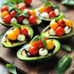 - Ripe avocados - Cherry tomatoes - Fresh mozzarella balls (bocconcini) - Fresh basil leaves - Balsamic glaze - Extra virgin olive oil - Salt and black pepper Choosing the perfect avocados: Look for avocados that feel slightly soft when you press them. They should not be too mushy. A ripe avocado will have a dark green skin. If they are too firm, they are not ready yet. Freshness of mozzarella and tomatoes: Choose mozzarella that is moist and soft. Fresh mozzarella balls should have a creamy texture. For tomatoes, pick ones that are bright and firm. Avoid any that feel mushy or have dark spots. Importance of quality olive oil: Select extra virgin olive oil for the best taste. High-quality oil adds flavor and richness. It should smell fruity and have a vibrant green color. A good olive oil enhances the dish and ties all the flavors together. You can find the full recipe for Caprese stuffed avocados above. - Slicing and hollowing avocados Start by cutting the avocados in half. Use a sharp knife to slice lengthwise. Carefully remove the pit with a spoon or knife. To make room for the filling, scoop out a bit of the flesh. Set the avocado halves aside on a plate. - Preparing the filling mixture In a medium bowl, mix the halved cherry tomatoes, mozzarella balls, and chopped basil. This will be your tasty filling. Drizzle olive oil over the mix. Add a pinch of salt and some black pepper to taste. Stir gently with a spatula until everything is well coated. - Stuffing the avocados Take a spoon and fill each avocado half with the Caprese mixture. Make sure to pack it in generously. For a final touch, drizzle balsamic glaze over the stuffed avocados right before serving. This adds flavor and makes the dish look beautiful. - Overview of prep time The total prep time for this dish is just 10 minutes. You can whip this up quickly for lunch or dinner. - Quick serving tips Serve the stuffed avocados on a colorful platter. Add extra basil leaves on top for a fresh look. This simple presentation boosts the dish’s appeal and makes it ready for your table. For the full recipe, see the earlier section. To make your Caprese stuffed avocados burst with flavor, try these tips. First, consider seasoning your filling. A pinch of garlic powder or a squeeze of lemon juice brings brightness. You can also mix in some red pepper flakes for a spicy kick. For unique ingredients, think outside the box. Add sliced olives for a briny taste. Or, try sun-dried tomatoes for a rich, tangy twist. If you want extra creaminess, mix in some creamy goat cheese. These small touches can transform your dish. Presentation matters, especially with such colorful ingredients. Serve the stuffed avocados on a rustic wooden board or a bright platter. This adds a fun touch to your table. For garnishing, sprinkle extra basil leaves on top. A light drizzle of balsamic glaze makes it look fancy and adds flavor. You can also add a sprinkle of coarse sea salt for a nice crunch. These simple steps make your dish not only tasty but also beautiful. For the full recipe, check out the Caprese Stuffed Avocados 🥑 section. {{image_4}} You can easily make vegan Caprese stuffed avocados. Instead of fresh mozzarella, use vegan cheese. Look for a brand that melts well. You can also add some silken tofu for creaminess. This keeps the dish rich while being plant-based. Gluten-free options are simple too. All the original ingredients are naturally gluten-free. Just make sure any store-bought items, like balsamic glaze, are certified gluten-free. This way, everyone can enjoy this tasty dish without worry. You can swap out cheeses in this recipe. Try feta or goat cheese for a different twist. These cheeses bring unique flavors that enhance the dish. Each one adds a creamy texture and a bit of tang. Substituting herbs and vegetables can also change things up. If you don’t have basil, use parsley or cilantro. You can even add a pinch of oregano for more flavor. Feel free to mix in some roasted peppers or olives for extra depth. For the full recipe, check out the details above. Enjoy experimenting with these variations! To keep your Caprese stuffed avocados fresh, store them in an airtight container. Place a piece of plastic wrap directly on the avocado flesh. This helps reduce air exposure. The fridge is the best place for leftovers. They can last up to two days, but they taste best when fresh. You have two choices: eating cold or reheating. Cold avocados maintain their creamy texture and fresh taste. They are perfect for warm days. If you prefer a warm dish, gently heat them in the oven. This method keeps the flavors intact. Avoid microwaving, as it can make the avocados mushy. Can I use other types of cheese? Yes, you can use other cheeses. Feta or goat cheese work well. They add a distinct taste. Try different cheeses to find your favorite. How do I prevent avocados from browning? To stop browning, squeeze a bit of lemon juice on the flesh. The acid slows down the browning. Cover the avocados tightly if you store them. Is balsamic glaze necessary? Balsamic glaze adds a nice tangy flavor. While it is not essential, it enhances taste and looks. You can skip it if you prefer a simpler dish. Caloric breakdown One serving of Caprese stuffed avocados has about 400 calories. This includes healthy fats from avocados and protein from cheese. Health benefits of avocados and Caprese ingredients Avocados are rich in healthy fats. They are good for heart health. Tomatoes provide vitamins and antioxidants. Basil adds flavor and has anti-inflammatory benefits. Together, they make a nutritious meal. Ideal sides to accompany the dish Serve with a light salad or crusty bread. A fresh green salad pairs nicely. You can also add a side of roasted veggies for more color. Pairing with beverages A crisp white wine like Sauvignon Blanc goes well. You can also serve it with sparkling water for a refreshing option. Enjoy your meal with drinks that complement the flavors! This blog post shared a delicious Caprese-stuffed avocado recipe. We covered key ingredients like ripe avocados, fresh mozzarella, and basil. You learned how to pick the best ingredients and prepare your dish step-by-step. I shared tips on flavor, presentation, and possible variations to suit diets. Lastly, we discussed storage and reheating options. Now you can enjoy this dish anytime, knowing its benefits and how to make it great. Experiment with ingredients and enjoy your culinary creation!